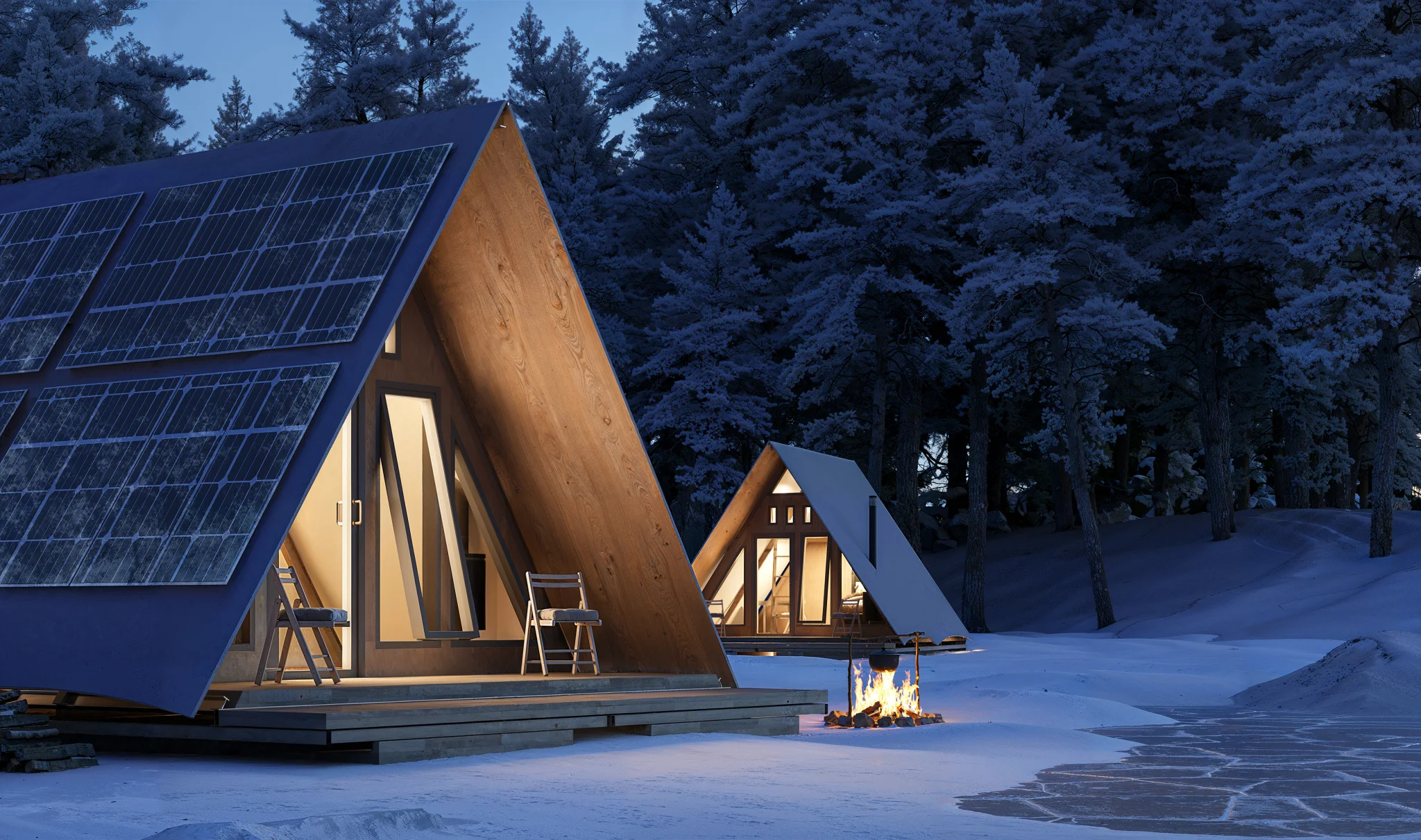TRAIL-FORM A-frame units at dusk in a snow-covered forest, solar panels on the roofs.